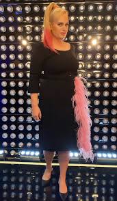 After graduating from the australian theatr. Rebel Wilson Prada Black Pink Feather Dress Filming Pooch Perfect