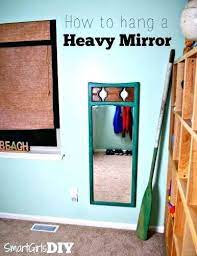 Here are a few options how to put the frame on a wall without nails How To Hang A Mirror On A Wall Without Nails Hanging A Large Mirror Wall Mirrors Hang A Wall Mirror Without Heavy Mirror Hanging Heavy Mirror Large Mirror Diy