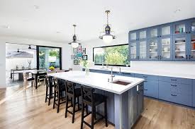 Open and bright, this coastal white kitchen is made for families and entertaining. Blue And White Interiors Living Rooms Kitchens Bedrooms And More