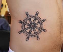 Skin rip navy anchor tattoo. Ship Wheel Tattoos Designs Ideas And Meaning Tattoos For You