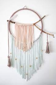 Those intricate knots can be mesmerizing! Dreamcatcher Kids Room Yarn Diy Yarn Wall Art Easy Diy Crafts