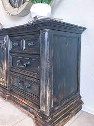 A tasteful blend of industrial, rustic, and modern accents mingle this chest, showcased in an appealing neutral wood tone on a black metal geometric base for stability. Balayage Painted Furniture Technique You Have To See Distressed Furniture Diy Distressed Furniture Painting Furniture Painting Techniques