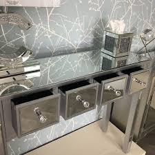 Mirrored console tables are excellent modern furniture items that increases the effect of spacious rooms and creates visually larger home interiors. Georgia Mirrored 4 Drawer Console Table Picture Perfect Home