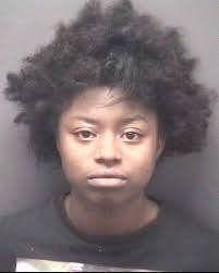 Woman charged with threatening school staff