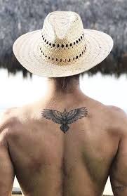 20 Back Tattoos For Men That Make A Statement In 2020 Small Eagle Tattoo Back Tattoos For Guys Small Tattoos For Guys