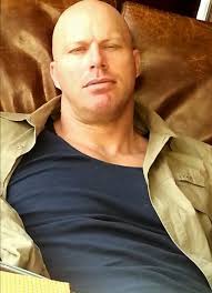 Thailand, 10 years ago. Just a guy trying to relax.until Fawn decided  wasn't allowed a moment's peace. Caught mid-blink and unprepared, but hey,  this is love in action!