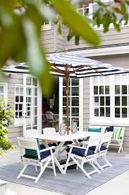 white x based outdoor dining table and