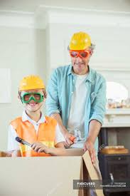 About father & son construction: Father And Son Playing With Construction Toys Leisure Three Quarter Length Stock Photo 199382858