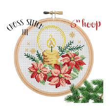 This counted cross stitch pattern of poinsettia flowers was created from the beautiful artwork of claire harkness. Christmas Candle Cross Stitch Kit Poinsettia Cross Stitch Funny Cross Stitch