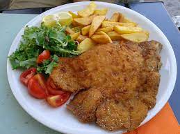 Un clásico de la gastronomía argentina, con sabores nuevos para experimentar. Milanesa Wikipedia