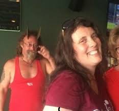 This is my daughter Jen, and yes, that guy behind her really does have  horns surgically implanted in his skull.