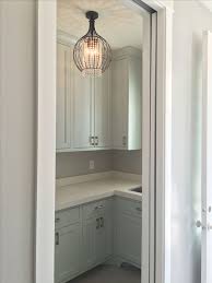 Laundry Room Light And Cabinets Paint Color Is Sherwin Williams Sea Salt Laundry Room Lighting Laundry Room Paint Color Laundry Room Colors