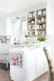 This is a design created by ashli another beautiful design was created by desjeux delaye. Trimming Open Shelves For The Holidays Christmas Kitchen Decor Christmas Staircase Decor Staircase Decor