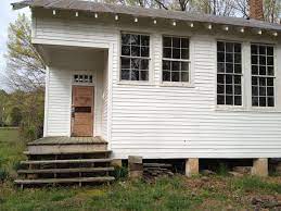 a rosenwald school schools built in the 2nd quarter of the 20th century with money raised by african american com old school house school fund public school