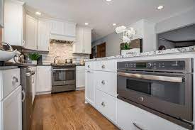 Unfinished white oak select hardwood flooring. Speed Cook Oven Under The Counter White Cabinets Red Oak Hardwood Floors Menomonee Falls Carmel Builders