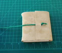 Kind of a bit of a tutorial on how to make a leather notebook. Bookbinding Fundamentals Long Stitch Leather Journal