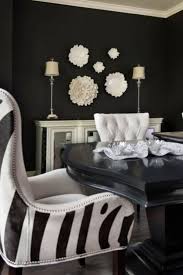 Round table, same wood colour scheme beach style dining room in sydney with white walls, medium hardwood floors and brown floor. 50 Dining Room Decor Ideas How To Use Black Color In A Stylish Way