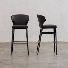The comfortable and functional design of this bar. Anders Bar Chair Faux Leather Noir Black Bar Stool Living By Design