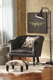 The Industrial Style Exposed Brick Walls Black Leather Accent Chair And Southwestern Accents Give This Liv Task Floor Lamp Floor Lamps Living Room Floor Lamp