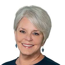 Myra Bain Sheddan, Broker