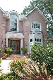The client's sister actually requested the subdued shade, deeming it the best color to highlight the property's gardens. Pics Of Pink Brick Houses Photos Tagged Pink Brick House At Film North Florida Pensa Brick Exterior House Brick House Exterior Colors Exterior House Colors