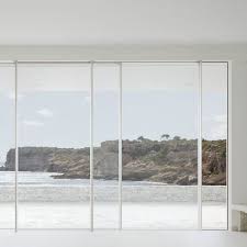 A sliding patio door is a glass door, half of which is fixed in place and half which slides over the fixed portion. Sliding Patio Door Inline Sky Frame Metal Double Glazed Triple Glazed