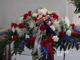 A flower delivery for funeral gatherings should be a reflection of your respect and love for the dearly departed. Military Tribute Casket Spray In Fulton Ny Claudette S Flowers And Gifts