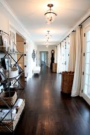 Wide Open Hallway White On White Black Hardware Natural Textures Matching Lighting French Doors Country Modern Home Home Michigan House Plans
