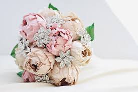 Make sure to add them towards the centre, as they are heavy and must be. Paper Peonies And Vintage Brooches Wedding Bouquet