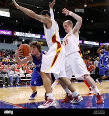 Saint Louis' Kyle Cassity, left, looks to a pass against Iowa State's  Charles Boozer, center, and Scott Christopherson during the first half of  an NCAA college men's basketball game in the Chicago