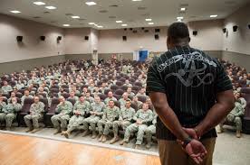 Shoulder to shoulder with an NFL legend: Herschel Walker visits Fort Riley 