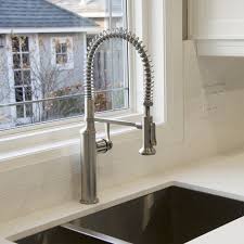 A kitchen faucet (below) may project more into the sink opening because of the larger sink area and the need to wash/rinse large pans and such. Kohler Sous Pull Down Faucet Review Just Like The Pros