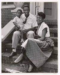 Jackie robinson played himself in the jackie robinson story , a biopic about his life released in 1950. Brooklyn Dodger Baseball Star Jackie Robinson Holding His Young Son Jackie Jr On His Lap As He Sits With His Wife Rachel On Front Steps Of Their Home International Center Of