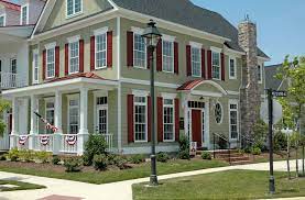 Green house with maroon shutters. 7 Beautiful Green House Siding Ideas Allura Usa