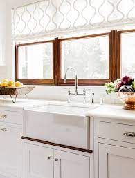 7 kitchen window treatments and roman shades ideas that work best for both a stylish decor & function. Choosing Window Treatments For Your Kitchen Window Home Bunch An Interior Design Luxury Homes Blog Kitchen Sink Window Kitchen Valances Kitchen Decor