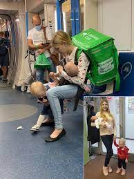 A young mother from Russia was recently spotted delivering food on the  subway while managing the care of her two young children. The image of her  balancing both the food delivery task