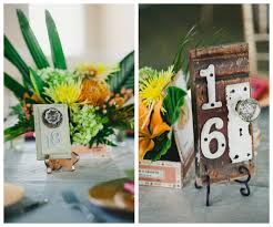 Whether you enjoy finding new, crafty uses for things or just want to reduce the number of things destined for your recycling bin, repurposing is for you. Wedding Reception Table Decor With Vintage Door Table Numbers Cigar Boxes And Orange And Yellow Flower Centerpieces Marry Me Tampa Bay Most Trusted Wedding Vendor Search And Real Wedding Inspiration Site