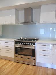 Pale Blue Glass Splash Back In The Kitchen Love The White Gloss Cabinets And The Handles Are Kitchen Renovation Gloss Kitchen Cabinets Custom Kitchen Cabinets