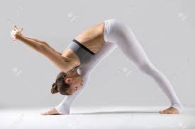 The top stands about 50 inches above the ground and the base. Young Attractive Woman Practicing Yoga Standing In One Sided Fold Pyramid Exercise Parsvottanasana Pose Working Out Wearing Sportswear Indoor Full Length Isolated Against Grey Studio Background Stock Photo Picture And Royalty Free