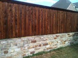 Stone Wall With Fence Top Connect Wood Fence Fence Design Landscaping Retaining Walls