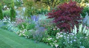 They tend to suit those who don't like to be restricted to plant choice, straight lines and formality. Cottage Garden With Burgandy Purple Whites And Soft Greens Small Native Garden Ideas Cottage Garden Garden Ideas Nz