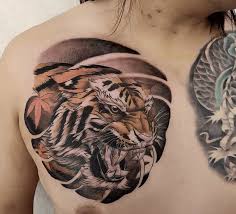 Top of the foot tiger tattoo Tiger Tattoo Ideas You Need To Inspire You Tattoo Stylist In 2021 Tiger Tattoo Tiger Tattoo Design Chest Tattoo Tiger