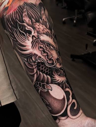 Neo Japanese Half sleeve tattoo of tiger fighting a dragon for the bro Johnny. Done in 3 sessions. Thank you Johnny for trusting me with your idea, loved the outcome of this