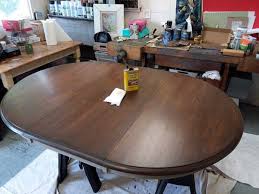 Prepping the top coat, applying the first coat, using a faux wood staining technique on the next few coats, and lastly, applying the sealer. How To Refinish A Dining Table Without Stripping The Original Coat
