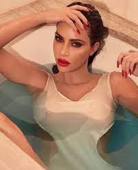Wait till you see what's in it! Kim Kardashian S Soaking Vest Goes Completely See Through As She Reclines In A Bath For Kkw Beauty Photoshoot