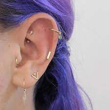 Trendy Modern Jewelry On Instagram Getting In The Mood With This Fancy Ear Featuring One Of Our 14 Karat Gol Cool Ear Piercings Piercing Jewelry Ear Jewelry