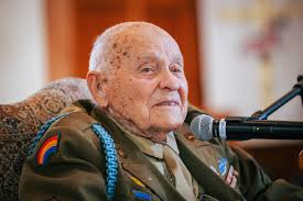 Eleventh and twelfth grade students welcomed Lockered 'Bud' Gahs, the last  living liberator of the Dachau concentration camp, to campus today for a  powerful discussion