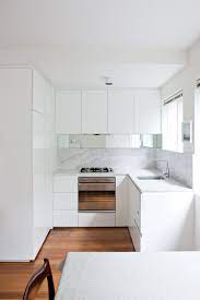 All white kitchen design rarely works well because it can be overwhelming. Small Kitchen Design Ideas Photography By Jason Busch Styling By Megan Morton Small Kitchen Renovations White Kitchen Design Small Kitchen Decor
