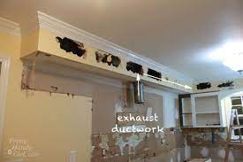 Use a skinny flat pry bar and gently hammer it under the base of the crown molding (the molding will usually only be nailed to the soffit not the ceiling.) continue working from one side to the other prying up the molding. How To Remove A Soffit Kitchen Renovation Update Pretty Handy Girl