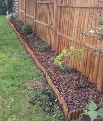 Here's a great idea if you don't like the look (or expense) of edging: Blooma Pine Edging Roll H 150mm L 1 8m Diy At B Q
